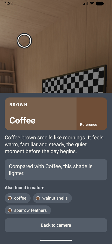Frozen image: the app says Brown, then Coffee, with a description of how the shade feels.